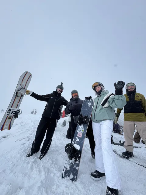 Group of snowboarders posing on the slope