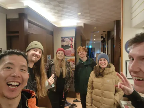 Housemates taking a selfie at a restaurant
