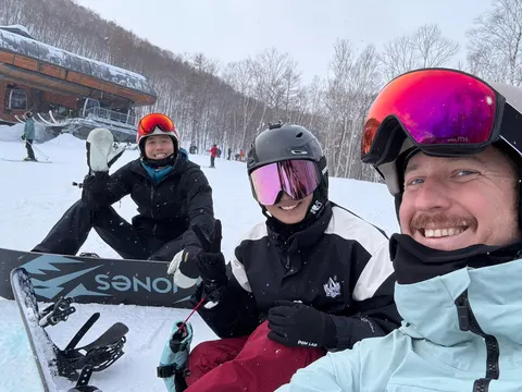 Three friends taking a selfie at the bottom of the lift