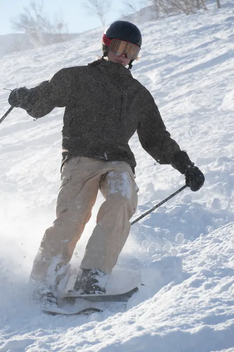 Skier turning through fresh snow