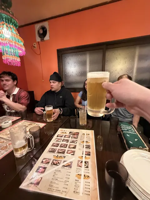 Raising a beer at dinner in town