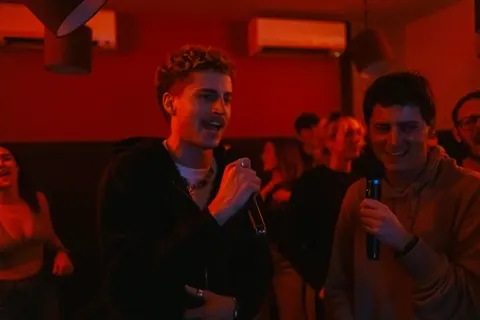 Housemates singing karaoke