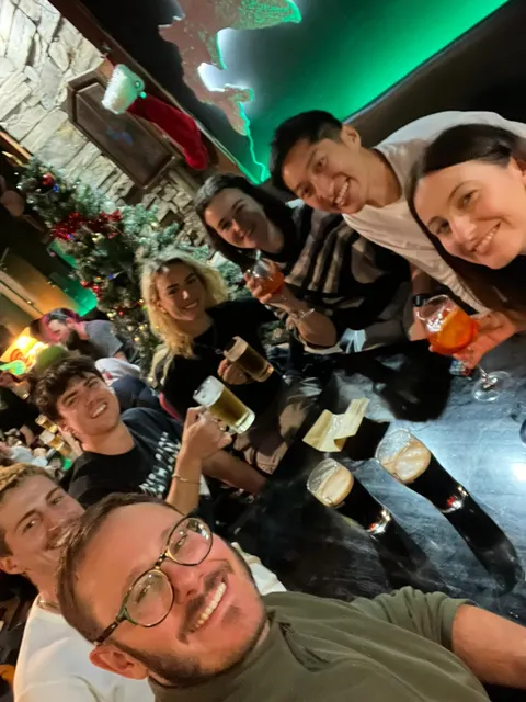 Group selfie at a bar