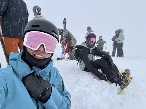 Selfie with friends sitting in the snow