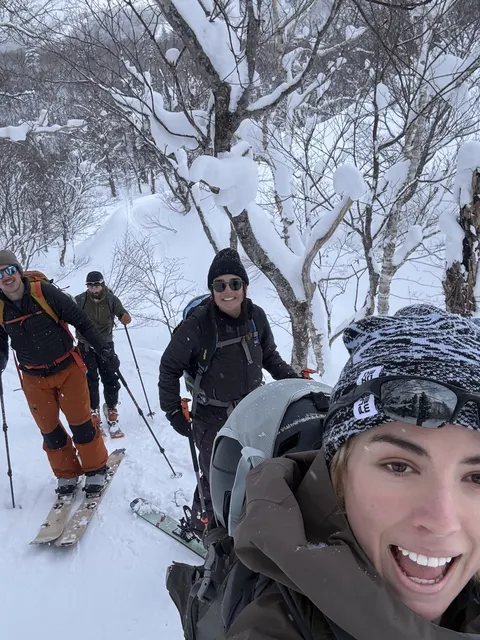 Smiling selfie with friends on a ski tour