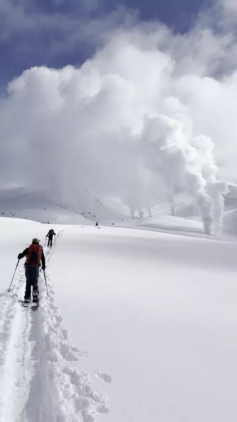 Ski touring towards steaming volcanic vents